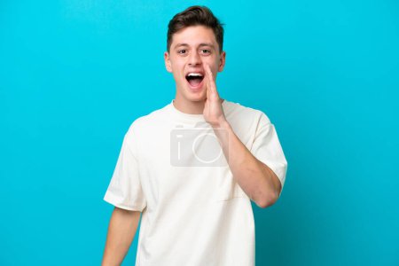 Photo for Young handsome Brazilian man isolated on blue background with surprise and shocked facial expression - Royalty Free Image