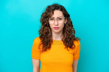 Photo for Young caucasian woman isolated on blue background With glasses - Royalty Free Image