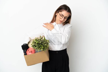 Photo for Young caucasian woman moving in new home among boxes isolated on white background suffering from pain in shoulder for having made an effort - Royalty Free Image