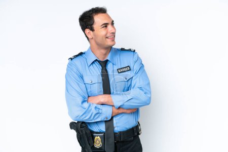 Foto de Young police caucasian man isolated on white background happy and smiling - Imagen libre de derechos