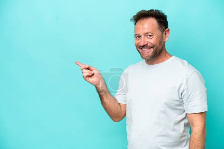 Photo for Middle age caucasian man isolated on blue background pointing finger to the side - Royalty Free Image