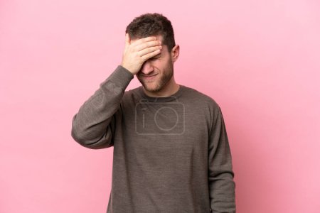 Photo for Young caucasian man isolated on pink background with headache - Royalty Free Image