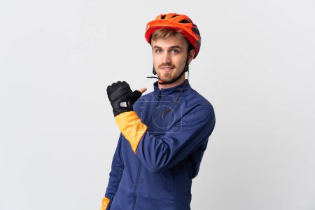 Photo for Young cyclist blonde man isolated on white background proud and self-satisfied - Royalty Free Image