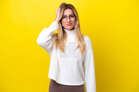Photo for Young Uruguayan woman isolated on yellow background with an expression of frustration and not understanding - Royalty Free Image