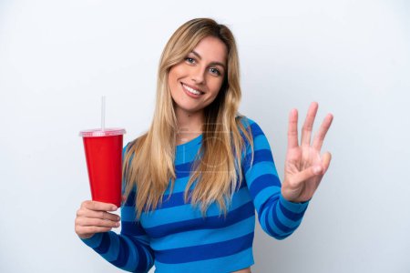 Photo for Young Uruguayan woman drinking soda isolated on white background happy and counting three with fingers - Royalty Free Image