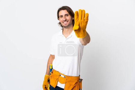 Photo for Young electrician man over isolated background happy and counting four with fingers - Royalty Free Image
