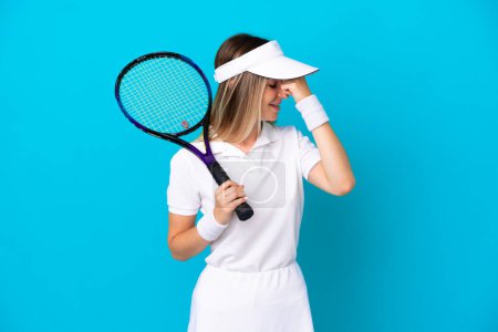 Photo for Young tennis player Romanian woman isolated on blue background laughing - Royalty Free Image