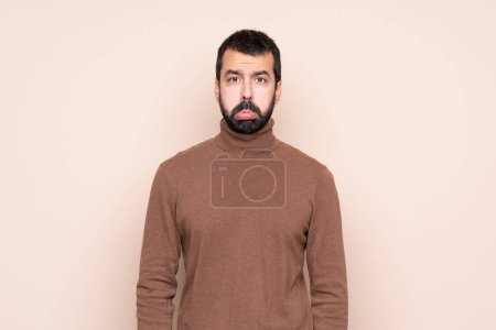 Photo for Man over isolated background with sad and depressed expression - Royalty Free Image