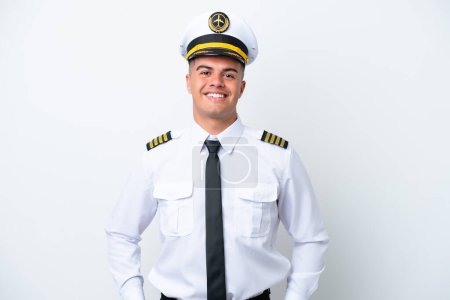 Foto de Airplane pilot caucasian man isolated on white background laughing - Imagen libre de derechos