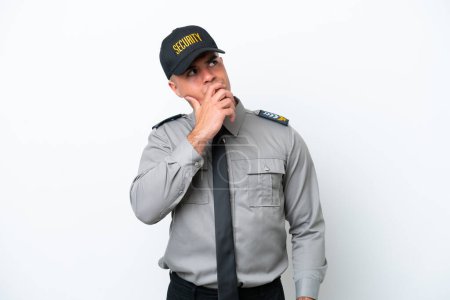 Photo for Young caucasian security man isolated on white background having doubts and with confuse face expression - Royalty Free Image