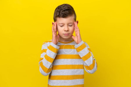Photo for Little caucasian boy isolated on yellow background with headache - Royalty Free Image