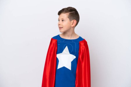 Photo for Super Hero little boy isolated on white background looking to the side and smiling - Royalty Free Image