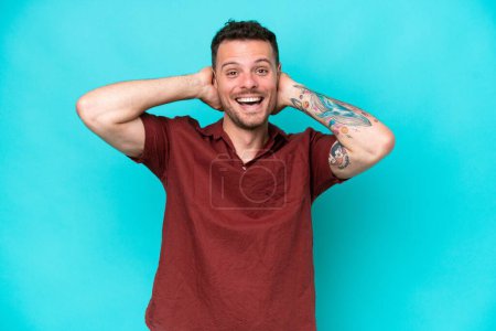 Photo for Young caucasian handsome man isolated on blue background laughing - Royalty Free Image
