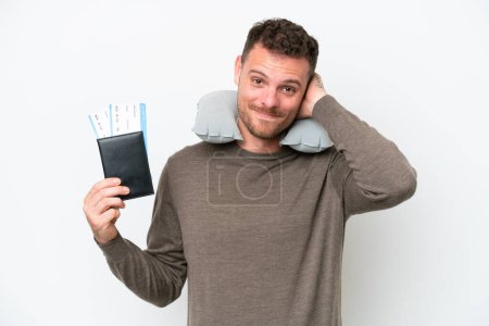 Téléchargez les photos : Young caucasian man holding a passport isolated on white background laughing - en image libre de droit