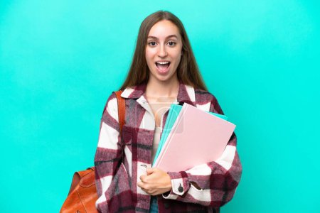 Photo for Young student caucasian woman isolated on blue background with surprise facial expression - Royalty Free Image