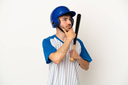 Photo for Young caucasian man playing baseball isolated on white background and looking up - Royalty Free Image