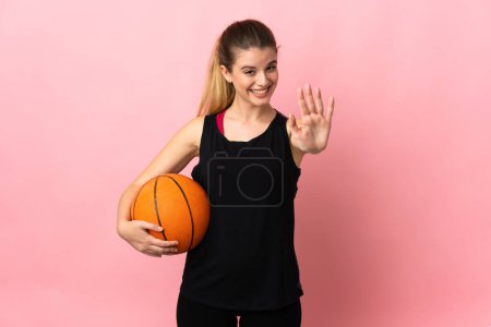 Photo for Young blonde woman playing basketball isolated on pink background counting five with fingers - Royalty Free Image
