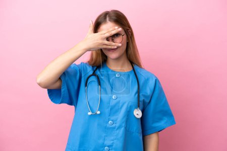 Photo for Young surgeon doctor woman isolated on pink background covering eyes by hands and smiling - Royalty Free Image