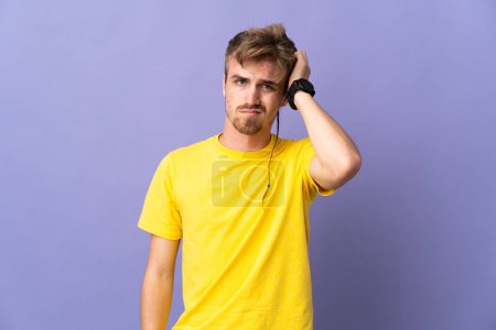 Photo for Young handsome blonde man isolated on purple background with an expression of frustration and not understanding - Royalty Free Image