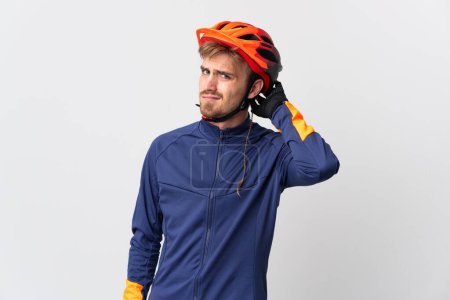Photo for Young cyclist blonde man isolated on white background having doubts - Royalty Free Image