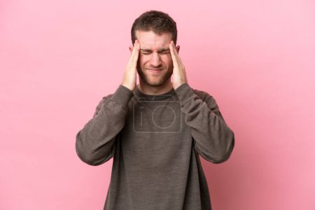 Photo for Young caucasian man isolated on pink background with headache - Royalty Free Image