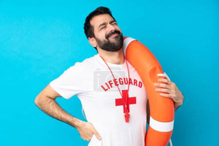 Photo for Lifeguard man over isolated blue background suffering from backache for having made an effort - Royalty Free Image