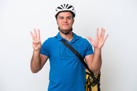 Young caucasian man with thermal backpack isolated on white background counting eight with fingers
