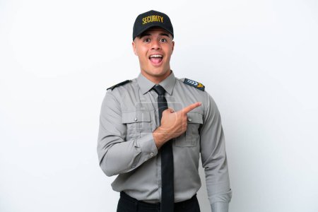 Photo for Young caucasian security man isolated on white background surprised and pointing side - Royalty Free Image