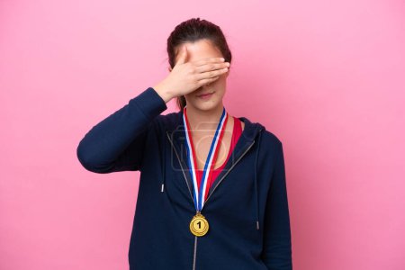 Photo for Young Brazilian sport woman with medals isolated on pink background covering eyes by hands. Do not want to see something - Royalty Free Image