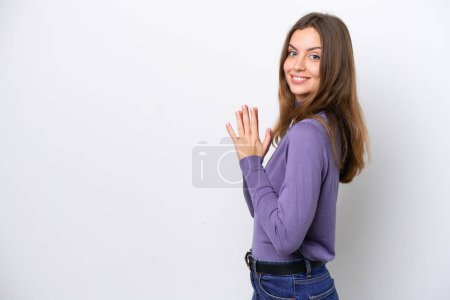 Young caucasian woman isolated on white background scheming something