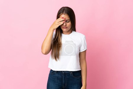 Photo for Young Uruguayan woman isolated on pink background with headache - Royalty Free Image