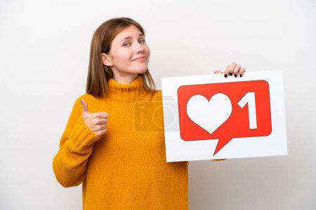 Photo for Young English woman isolated on white background holding a placard with Like icon with thumb up - Royalty Free Image