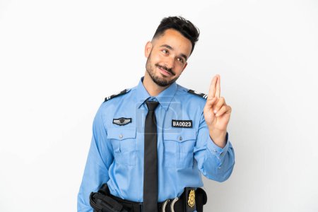 Photo for Police caucasian man isolated on white background with fingers crossing and wishing the best - Royalty Free Image