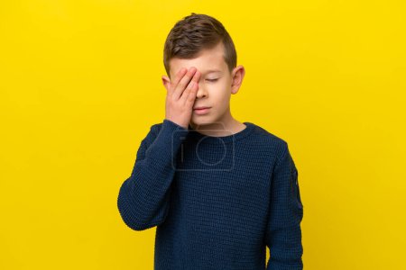 Photo for Little caucasian boy isolated on yellow background with headache - Royalty Free Image