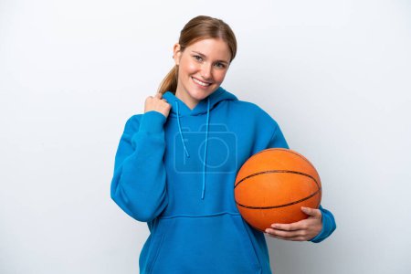 Téléchargez les photos : Young caucasian woman playing basketball isolated on white background laughing - en image libre de droit