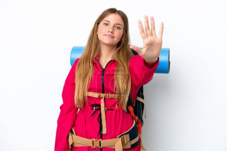 Photo for Young mountaineer girl with a big backpack over isolated white background counting five with fingers - Royalty Free Image