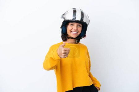 Téléchargez les photos : Femme avec un casque de moto avec les pouces levés parce que quelque chose de bon est arrivé - en image libre de droit