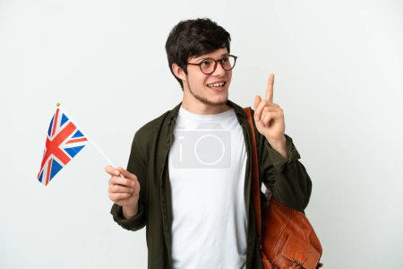 Photo for Young Russian man holding an United Kingdom flag isolated on white background pointing up a great idea - Royalty Free Image