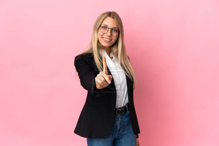 Photo for Business blonde woman isolated on pink background showing and lifting a finger - Royalty Free Image