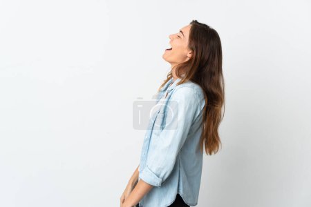 Photo for Young Ireland woman isolated on white background laughing in lateral position - Royalty Free Image