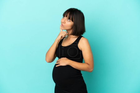 Photo for Woman over isolated background pregnant and thinking - Royalty Free Image