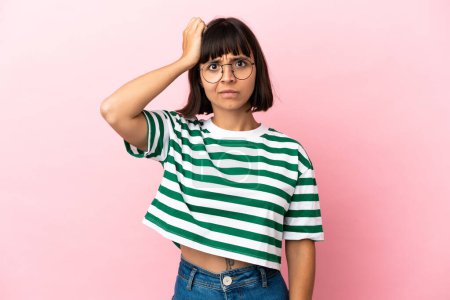 Photo for Young mixed race woman isolated on pink background with an expression of frustration and not understanding - Royalty Free Image