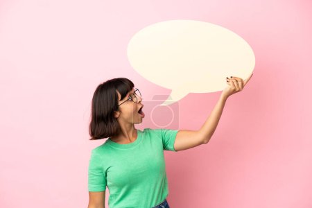 Photo for Youing woman holding an empty speech bubble - Royalty Free Image