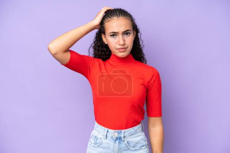 Photo for Young woman isolated on purple background with an expression of frustration and not understanding - Royalty Free Image