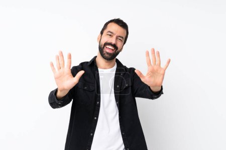 Photo for Young man with beard over isolated white background counting ten with fingers - Royalty Free Image