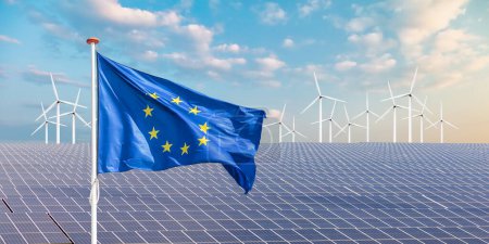 Official flag of the European Union in front of a large array of solar panels and wind turbines