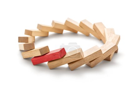 Photo for Stop the destructive processes -The red wooden block triggered a domino effect, Circle made of toppled wooden blocks on a white background, including clipping path - Royalty Free Image