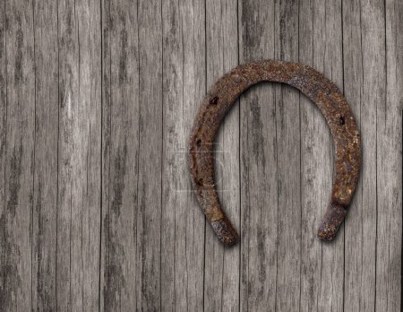 Photo for Old horseshoe on the wall of wooden planks - Royalty Free Image
