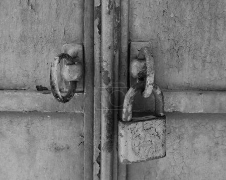 Old metal gate with external lock