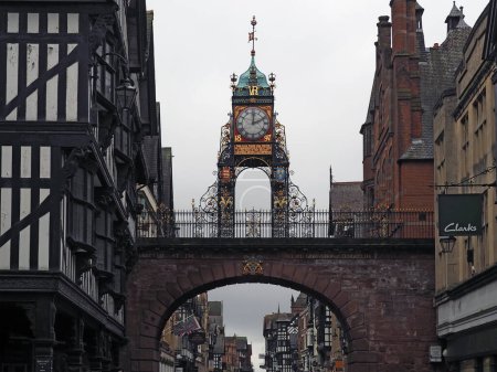 Photo for Chester. Cheshire, United Kingdom - 20 March 2024 : The Eastgate clock and clock in Chester city walls surrounded by the historic buildings on the road - Royalty Free Image